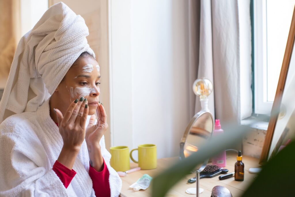 elegant glass vanity tray holding clean, authentic serums and oils reflecting morning light to get smooth skin
